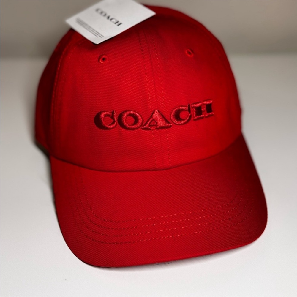 NWT Coach Red Cap with Coach Insignia on Front and adjustable back.